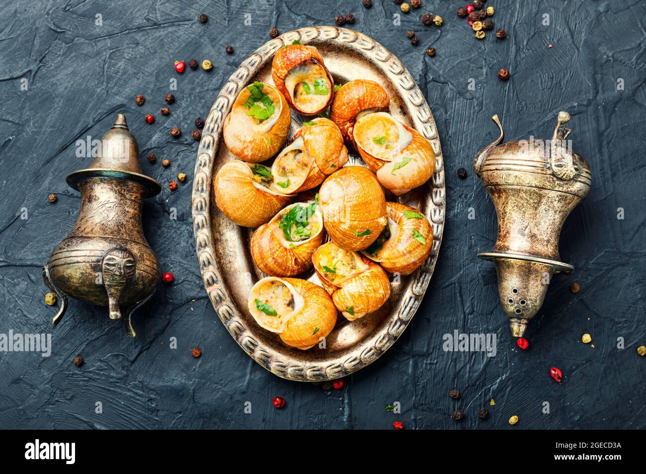 Edible snails stuffed with green butter, French delicacies Stock Photo
