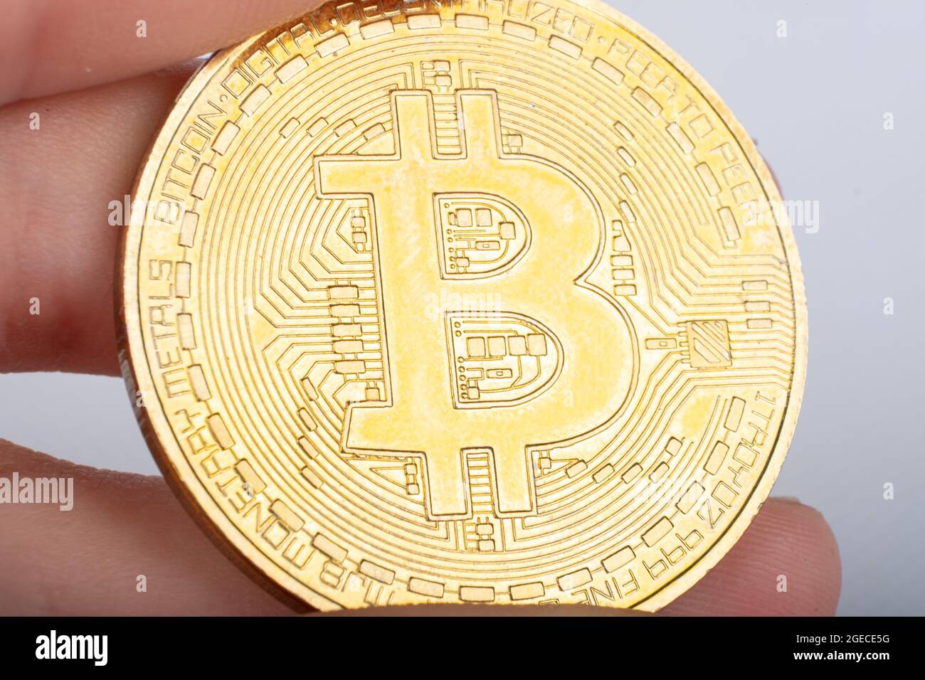 world cryptocurrency bitcoin coin in hand close up macro Stock Photo - Alamy