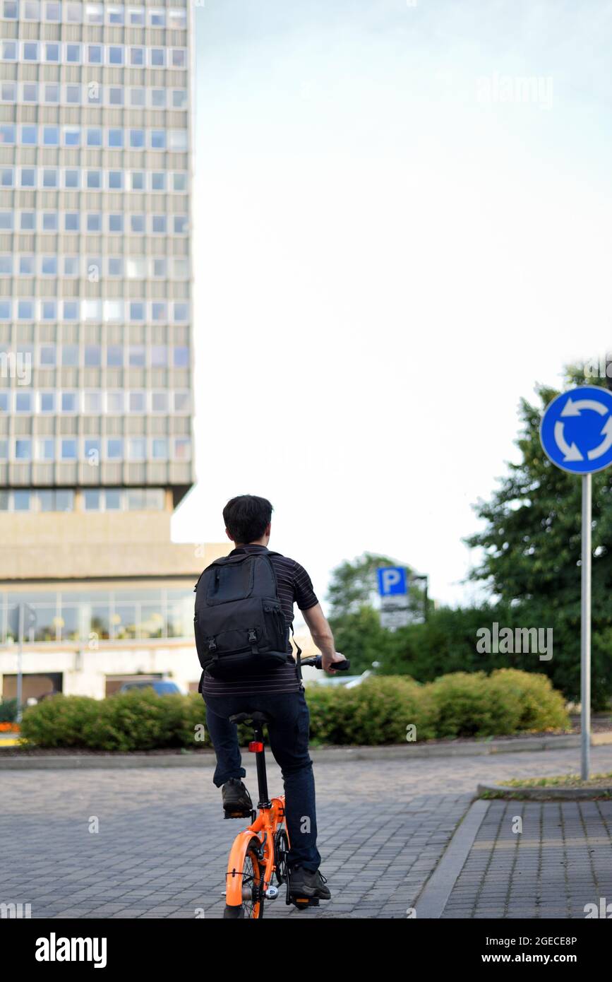 Cyclist and traffic rules. A cyclist rides through the city and