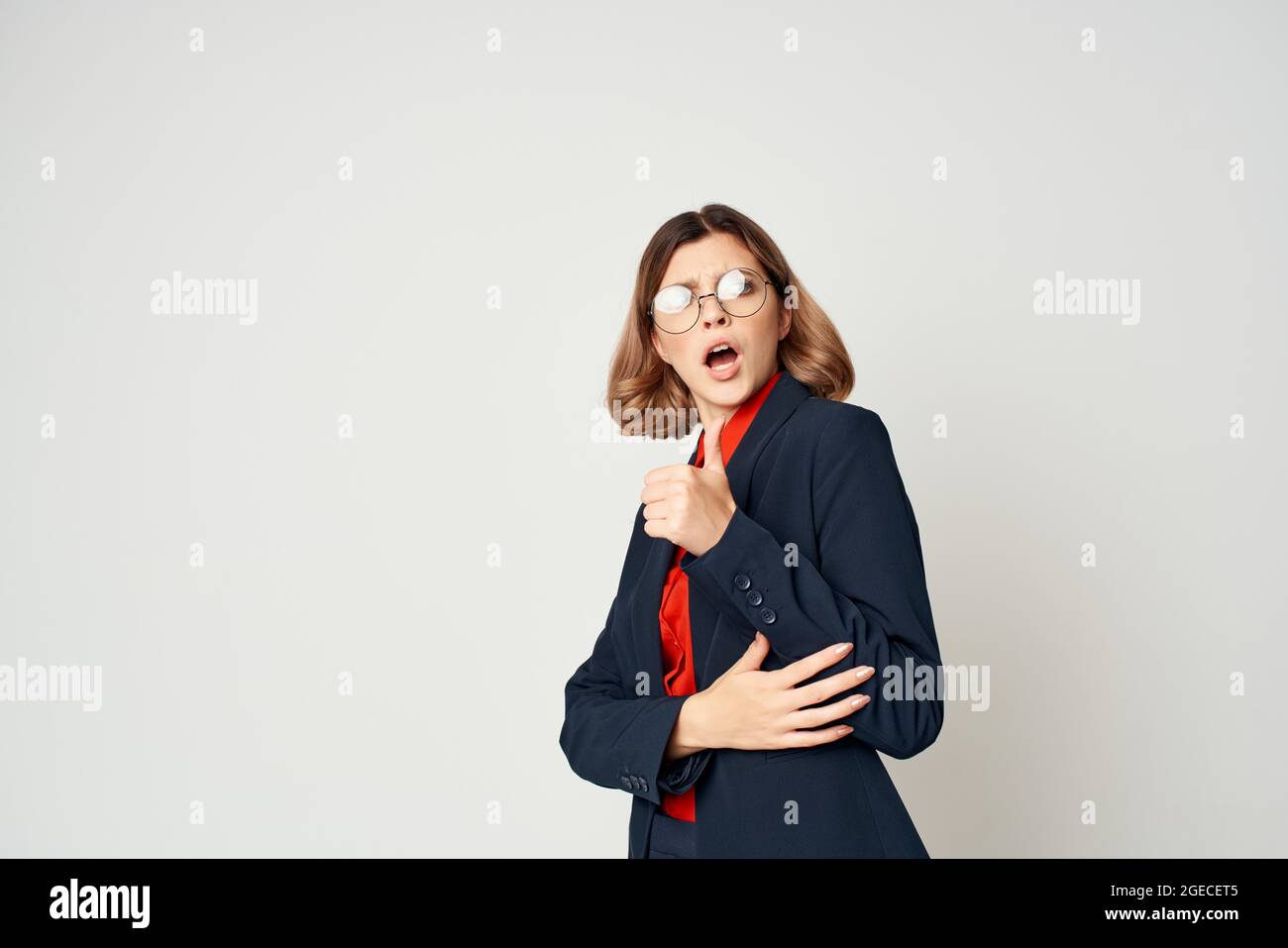 cheerful business woman in a suit gesturing with her hands work manager ...