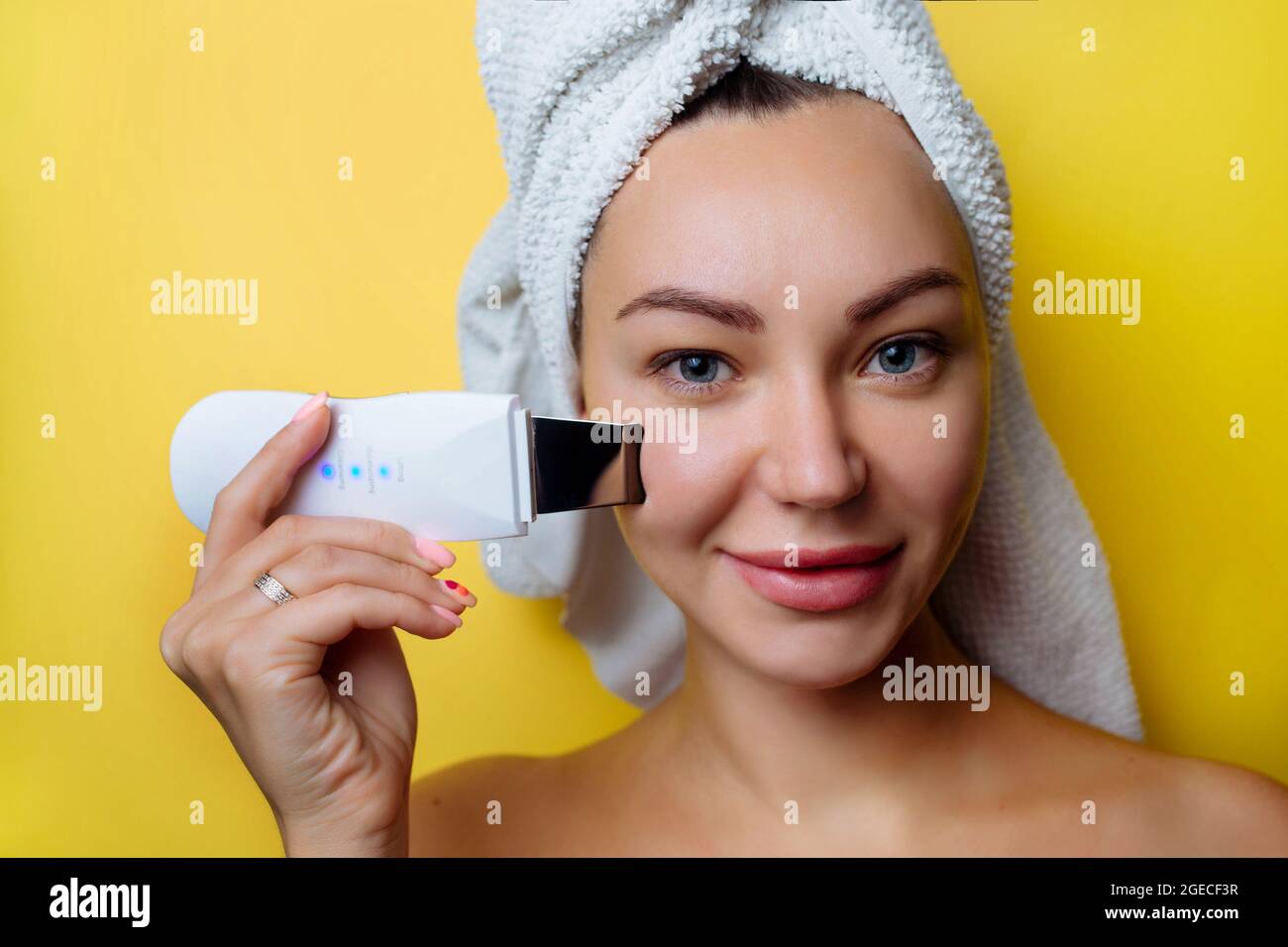 Ultrasonic Scrubber For Facial Skin Cleansing Girl In The Bathroom