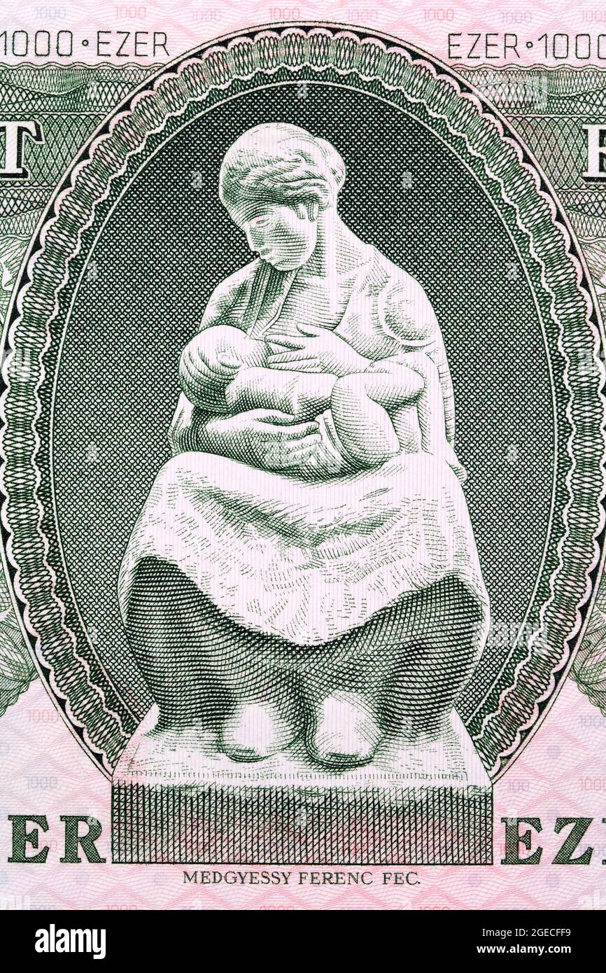 Mother nursing child from old Hungarian money - Forint Stock Photo