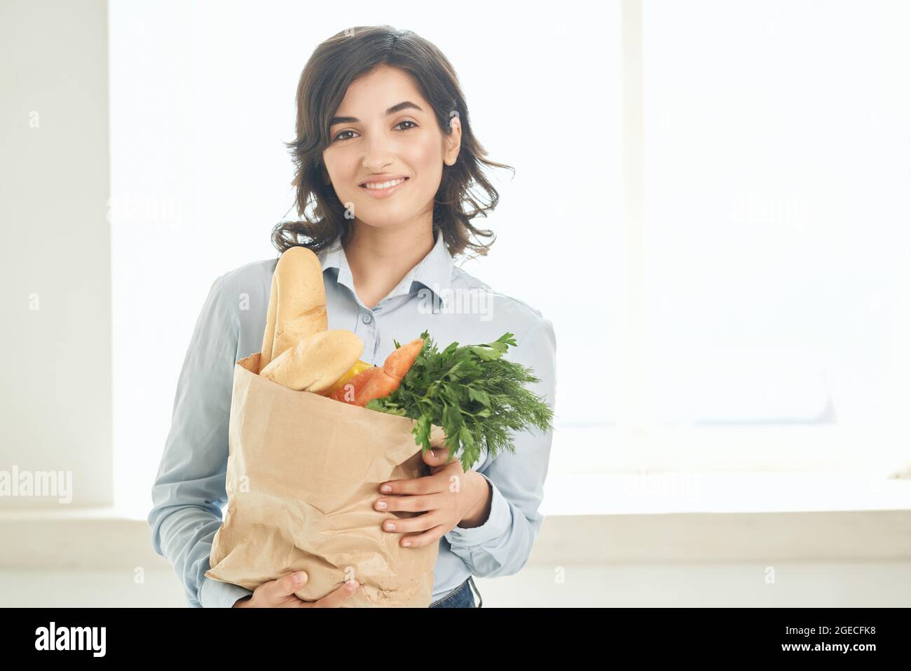 housewife with a package of groceries vegetables supermarket delivery ...