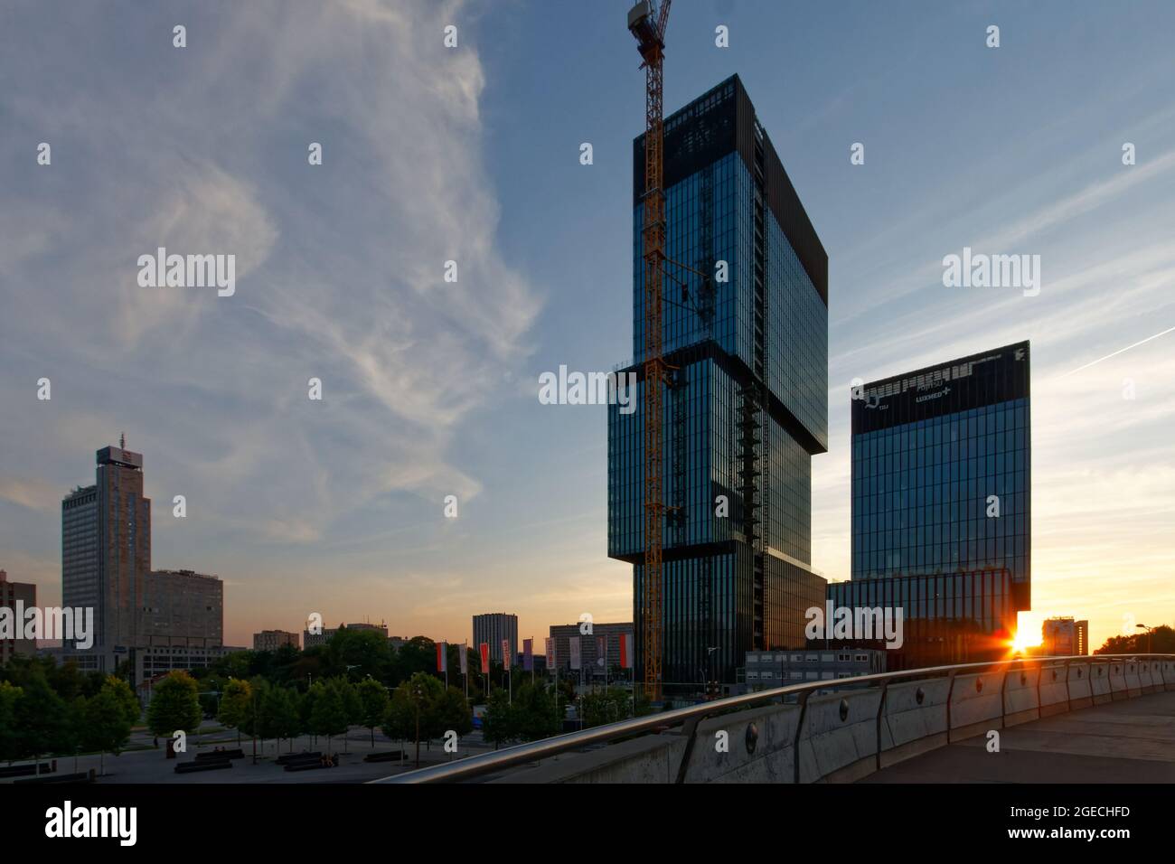 Two shifting towers of KTW office complex withte setting sun. Stock Photo