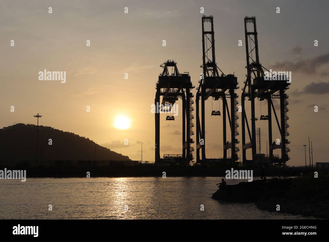 Silouette of huge cranes at Dockyard, Shipping port, Nhava Seva, Uran,  Maharashtra, India Stock Photo