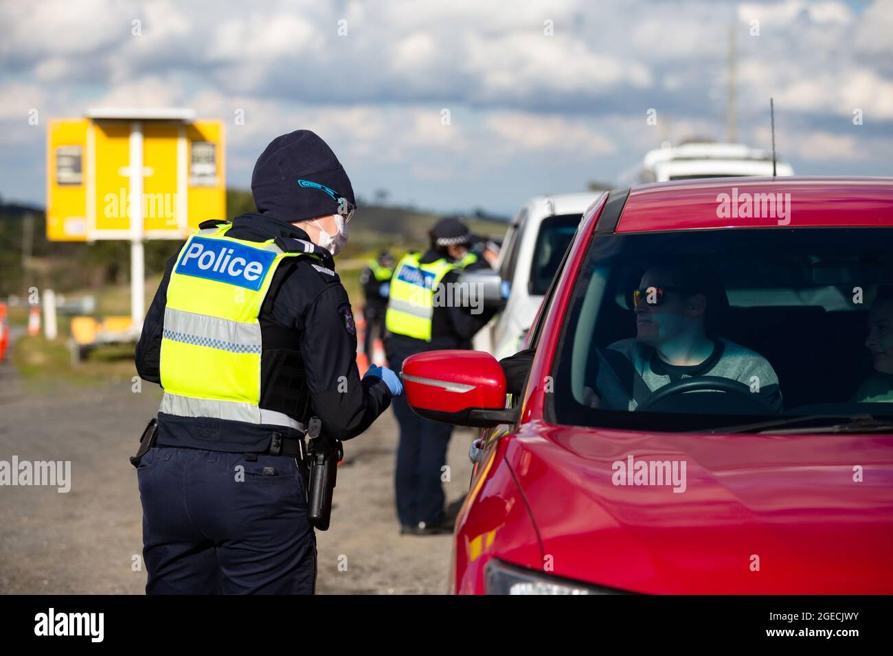 Gisborne, Australia, 9 July, 2020. Police are seen checking drivers  licences at a roadblock south of Gisborne as Melbourne plunges back into  Stage 3 lockdowns during COVID-19. After a sustained outbreak across