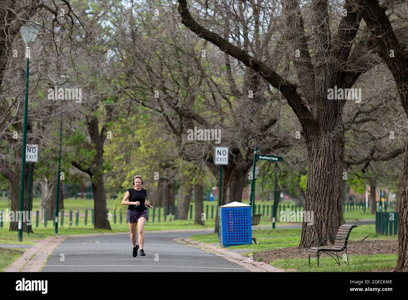Melbourne, Australia, 2 September, 2020. A woman is seen jogging in Yarra Park near the MCG as an announcement was made today by the AFL CEO, Gillon McLachlan that the 2020 Grand Final will be held in Brisbane due to Daniel Andrews draconian rules in Victoria during COVID-19 in Melbourne, Australia.  Premier Daniel Andrews Labor Government was given a six month extension to their State of Emergency Powers. Under these powers, the government need not justify their response to the pandemic or have to face any scrutiny. It risks the continuation of major events in Victoria and will plunge the sta Stock Photo