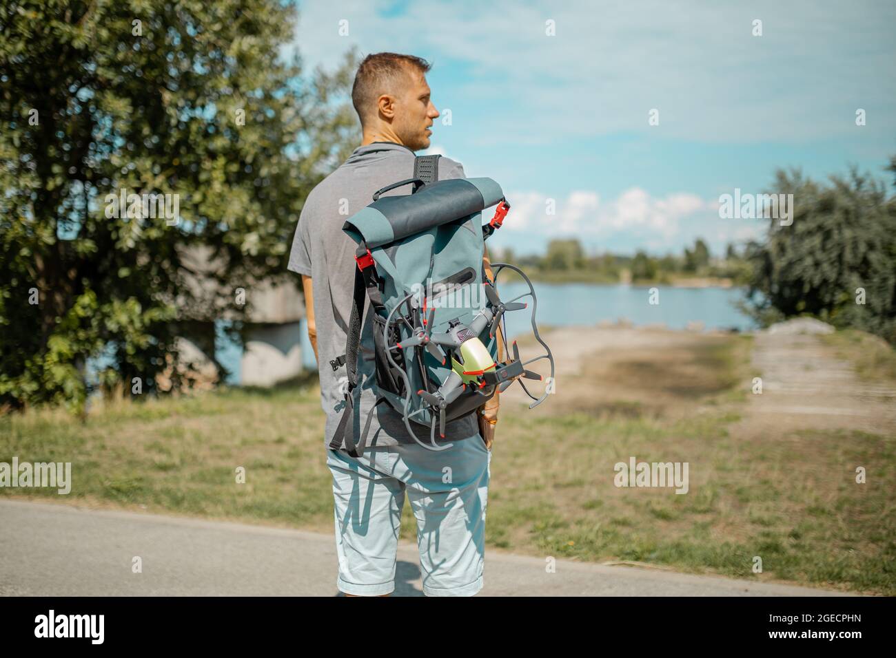 Man with a backpack ready to walk a long road and explore the world