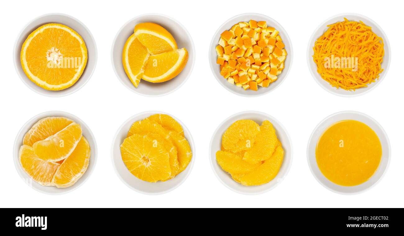 Fresh and processed oranges, in white bowls. Orange half, wedges, cutted peel, zest, segments, cross sections, supreme cut and freshly squeezed juice. Stock Photo