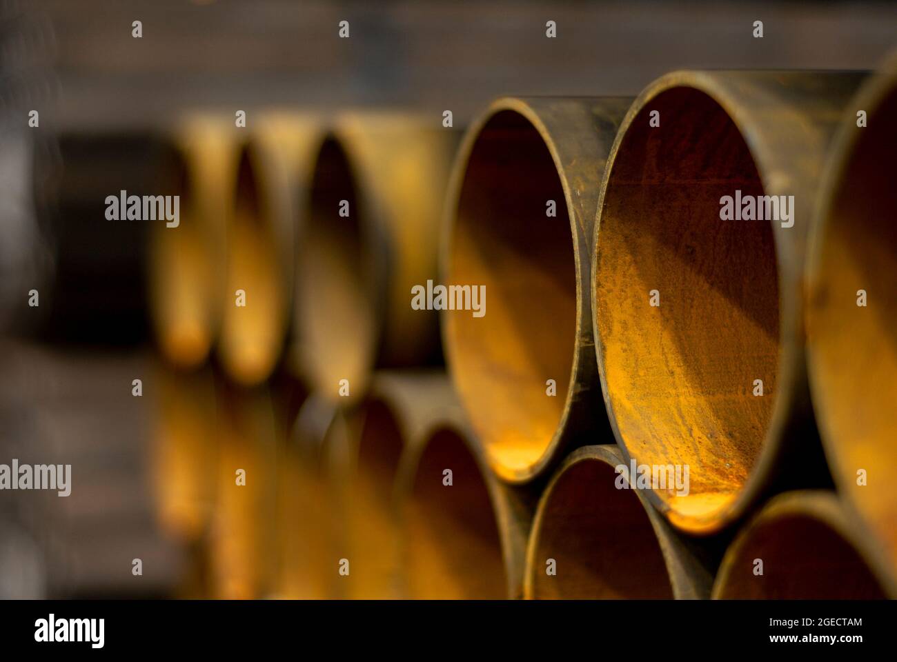 Rows of rusty steel tubes. in a steel foundry in the UK. Stock Photo