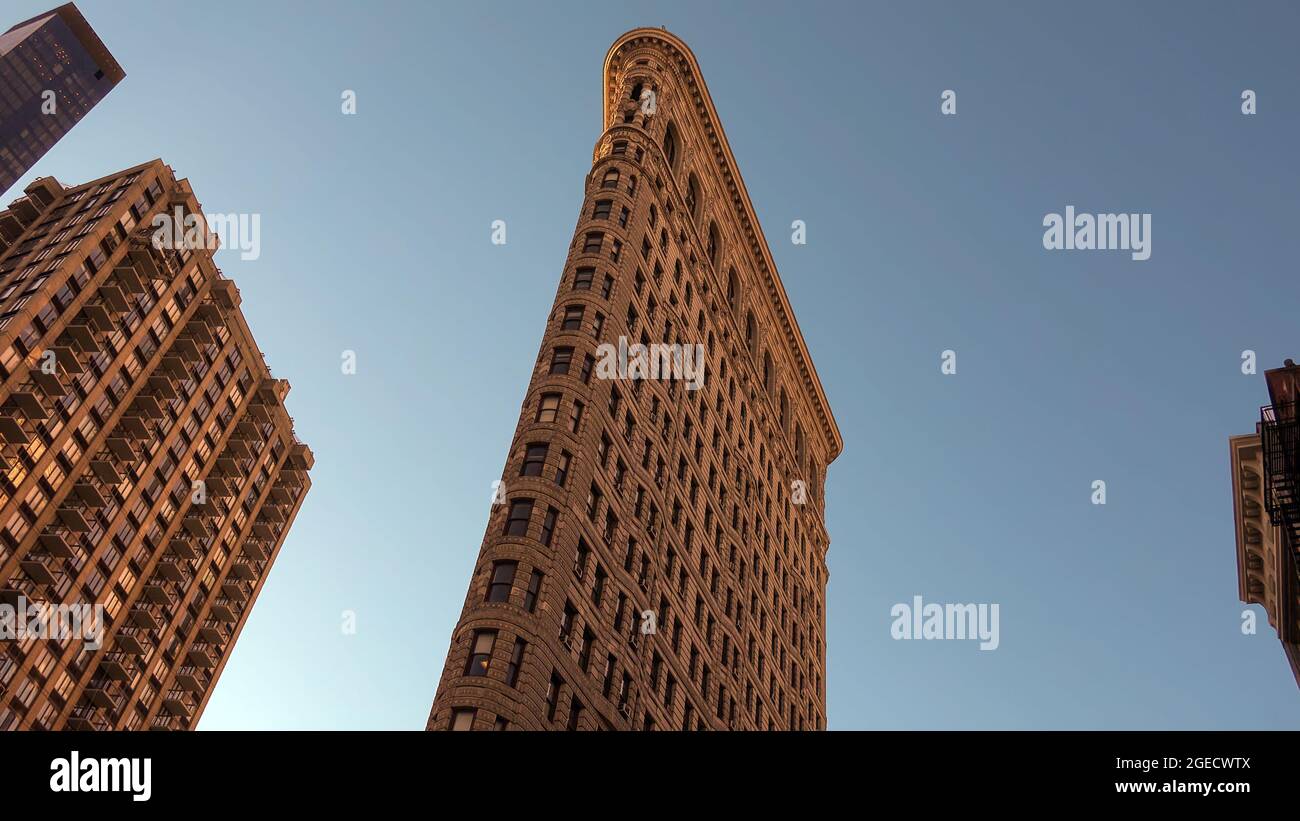 Low angle shot of flatiron building in madison square park in New York, USA Stock Photo