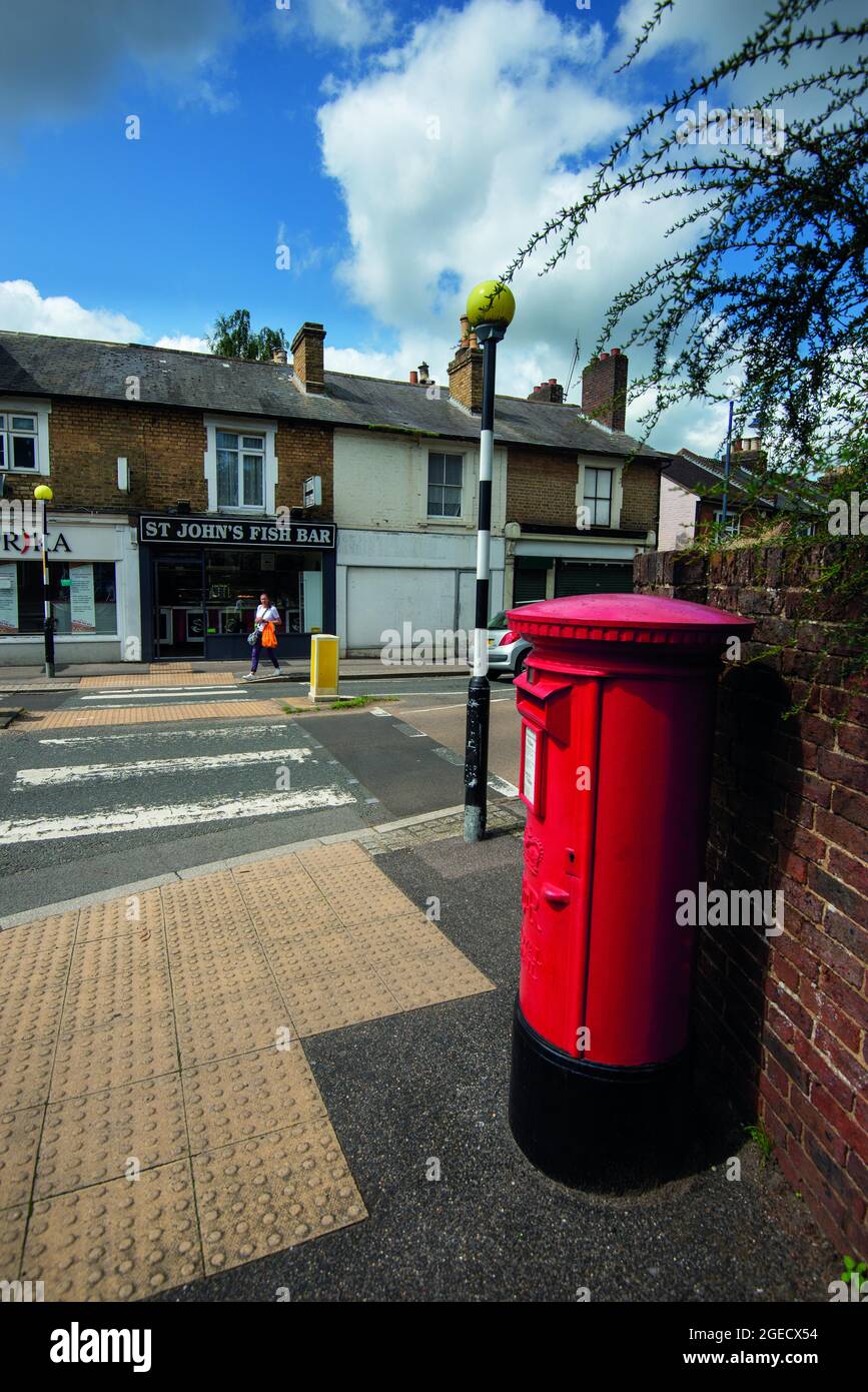 Urban England, a zebra crossing, red postbox and fish and chip shop on