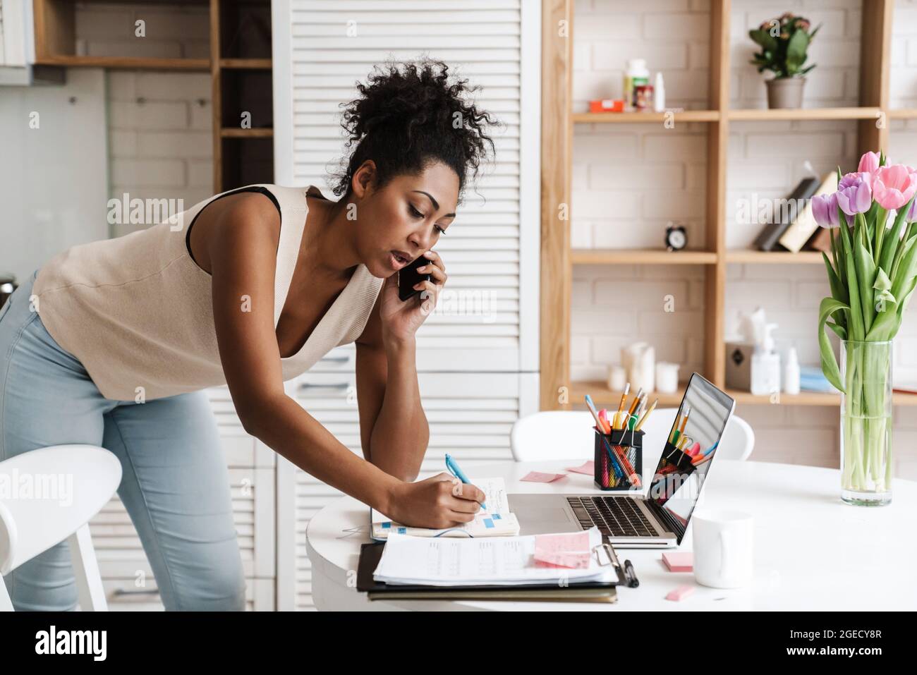 Black woman laptop writing hi-res stock photography and images - Alamy