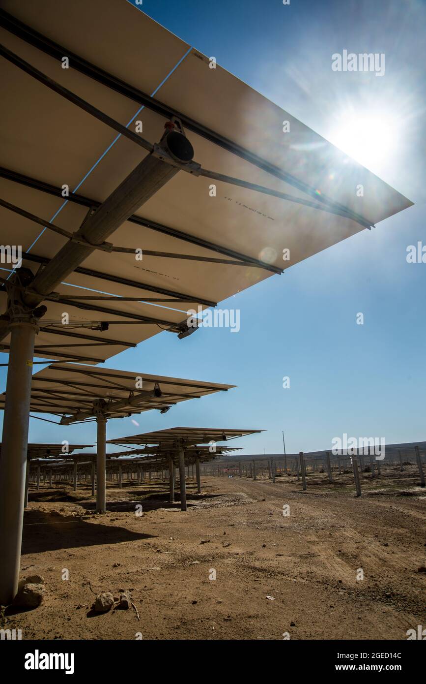 Solar reflectors part of a solar power plant, These reflectors concentrate solar power to produce electricity Stock Photo