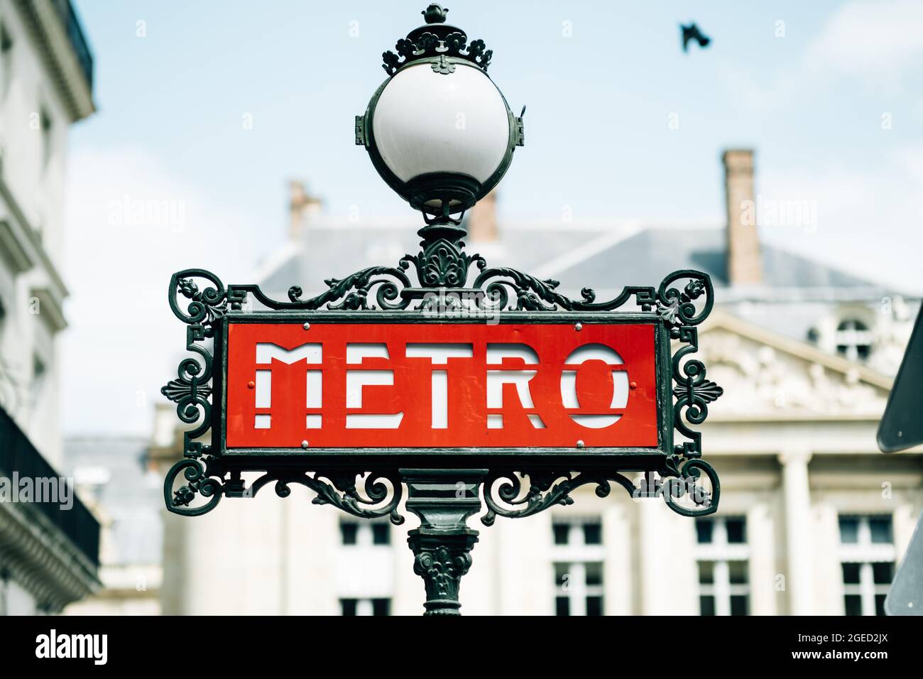 Vintage metro sign and a street lamp Stock Photo