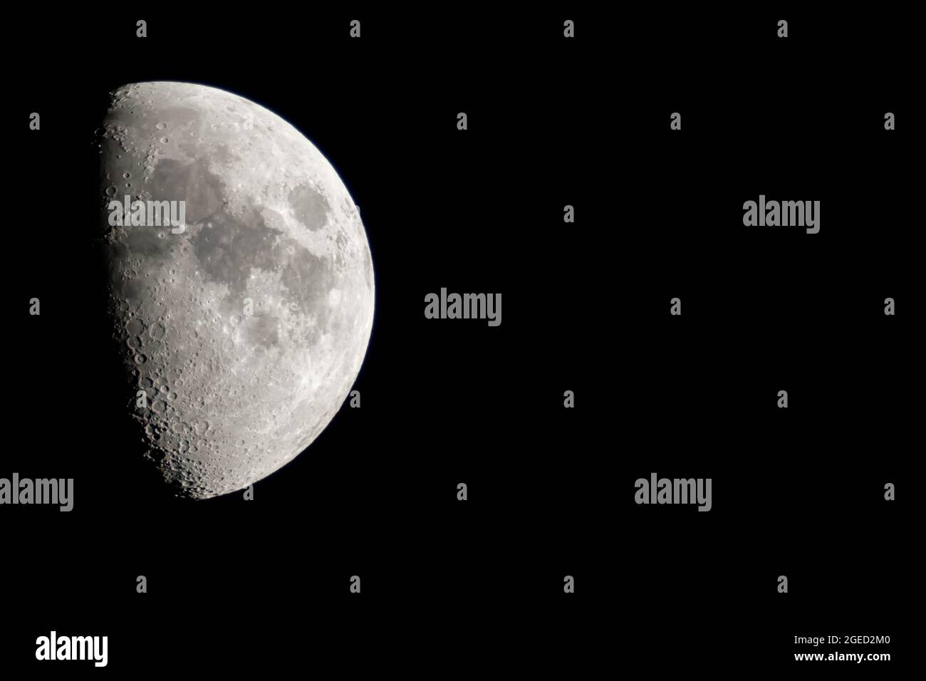 Quarter Moon- 1 week after the New Moon, the moon will revolve around the world about 1 in 4 of its orbit. We will see half of the sun-exposed side Stock Photo