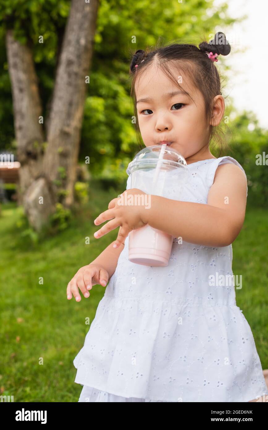 Child drinking through straw hires stock photography and images Alamy