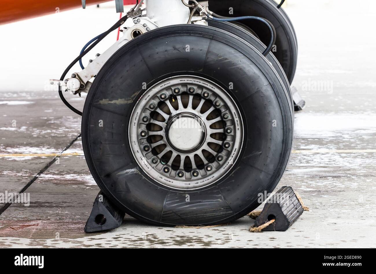 Landing gear rubber, tire under the wing of the aircraft Stock Photo