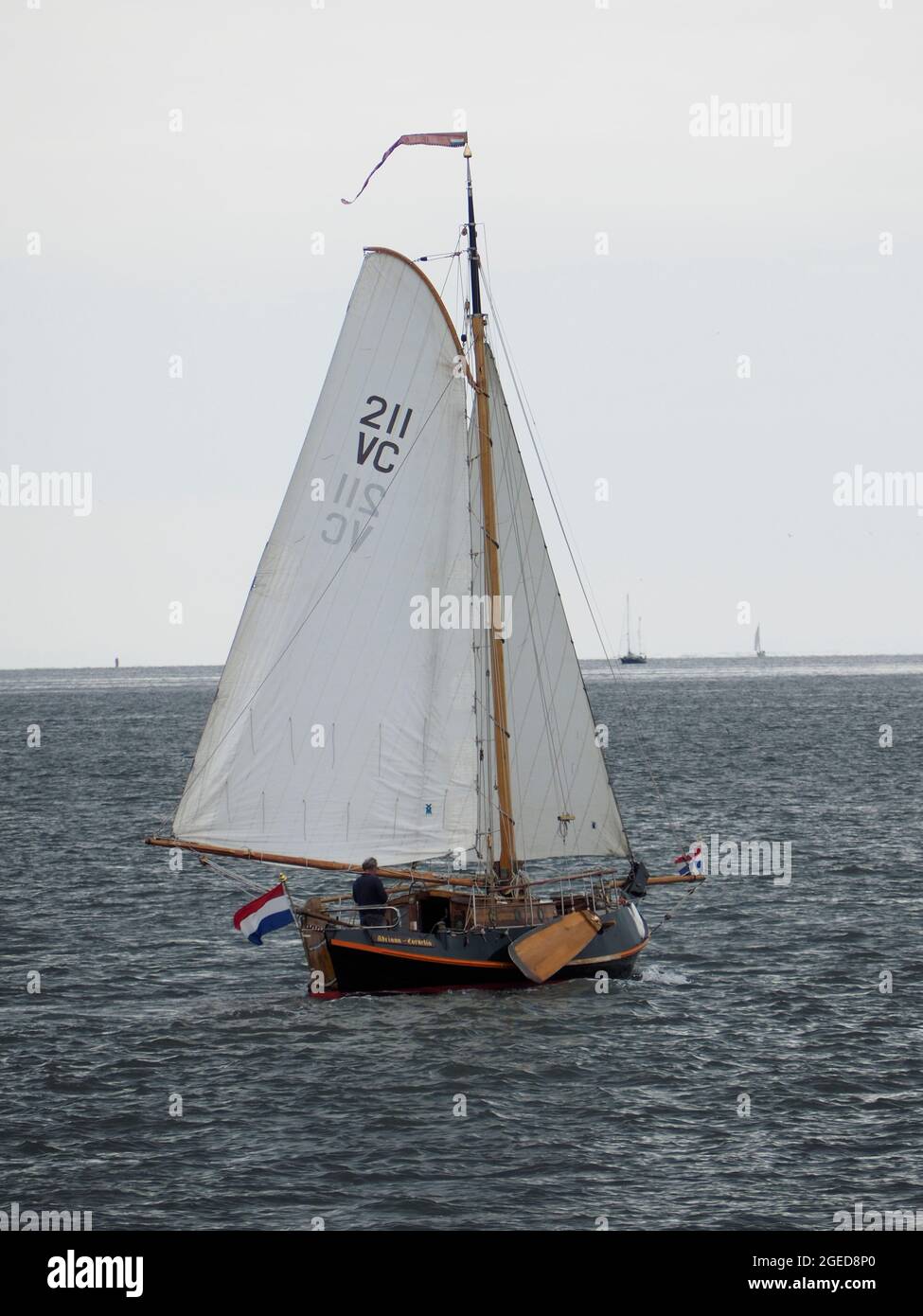 Classic vintage wooden Dutch sailing ship botter type under sail between Den Helder and Texel island, the Netherlands Stock Photo