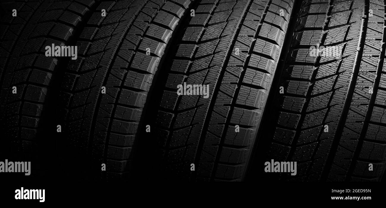 set of new car tires in a row. banner Stock Photo