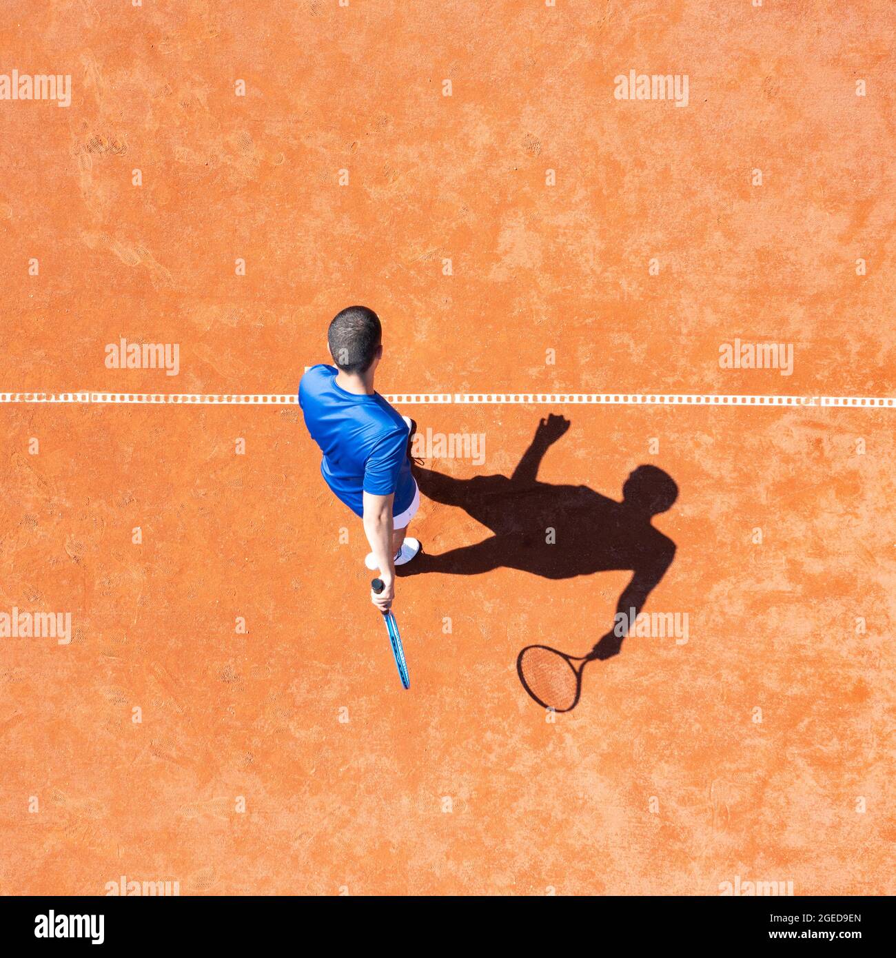 Aerial view of a professional tennis player preparing perform a first service Stock Photo