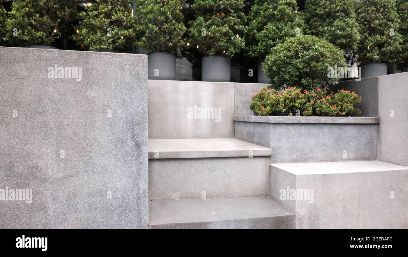 Cement Steps Shrub Garden outside of Siam Discovery Center Shopping Mall in Bangkok Thailand Stock Photo