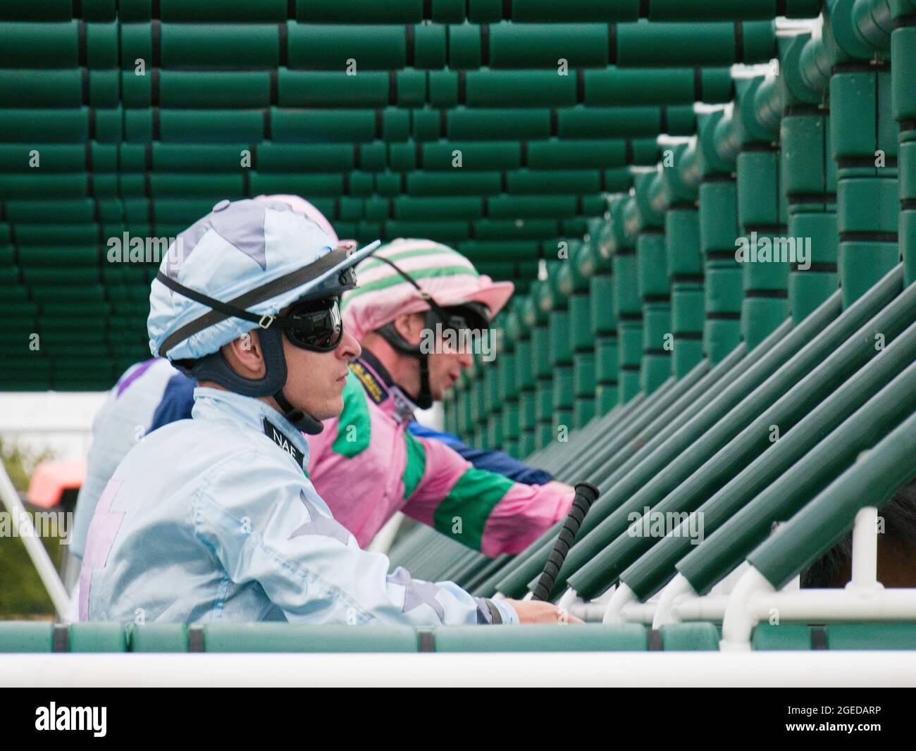 Jockeys Richard Kingscote and Jack Mitchell in the starting gate before a race at York Racecourse. Stock Photo