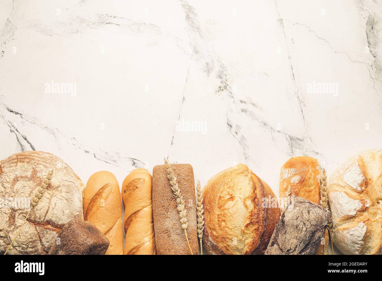 Assortment of fresh bread on white background Stock Photo - Alamy