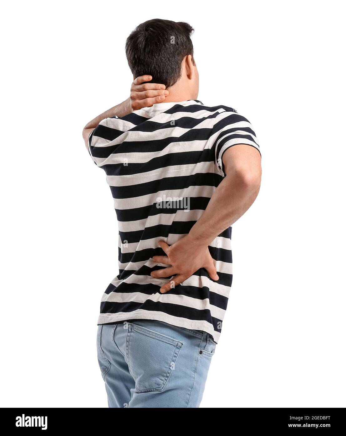 Young man suffering from back pain on white background Stock Photo - Alamy