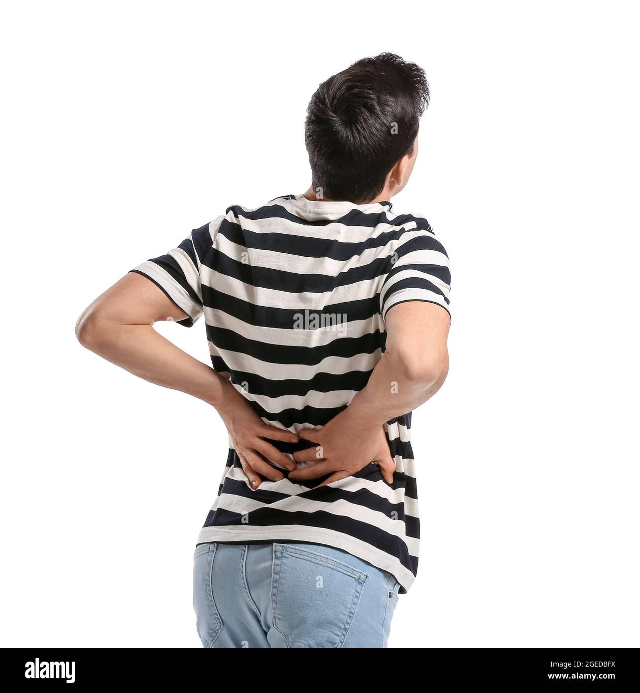 Young man suffering from back pain on white background Stock Photo - Alamy