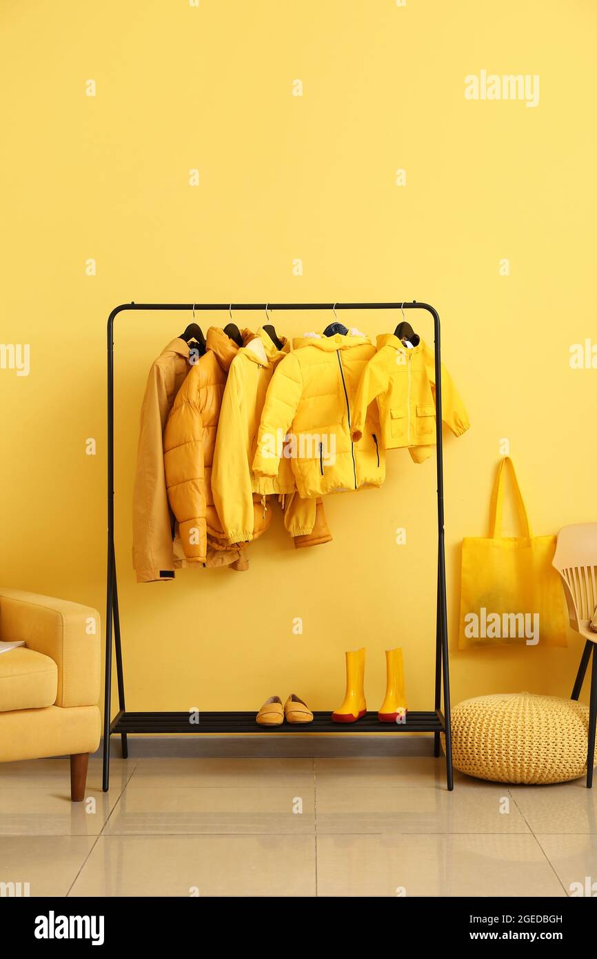 Interior of hallway with stylish clothes Stock Photo