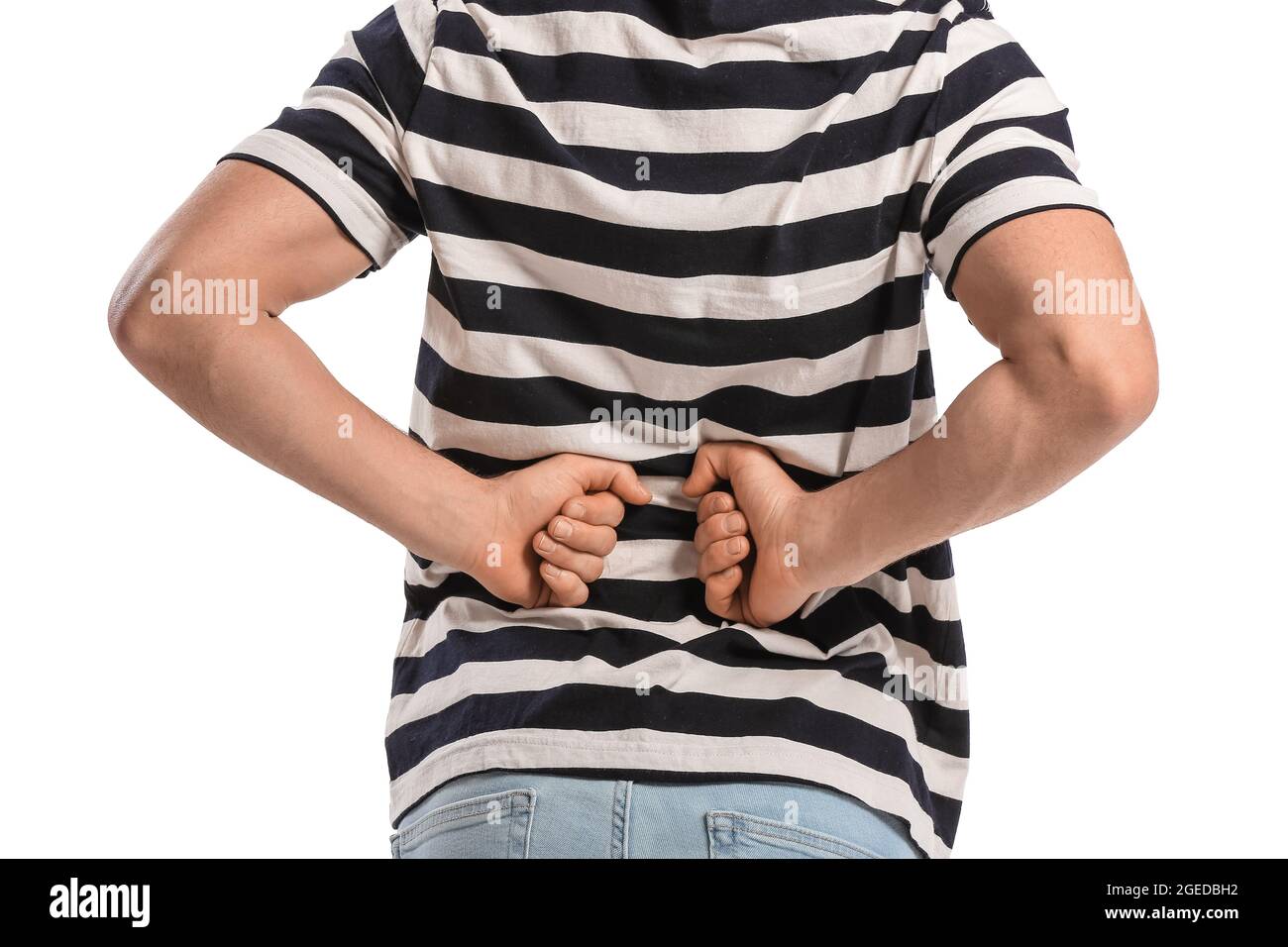 Young man suffering from back pain on white background Stock Photo - Alamy