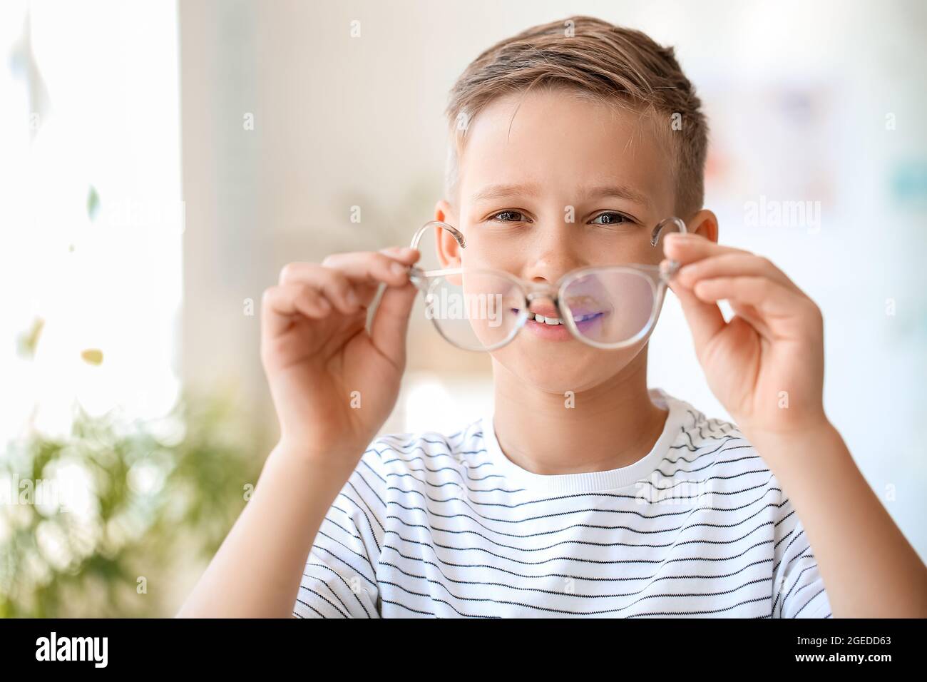 Little boy with glasses indoors Stock Photo Alamy