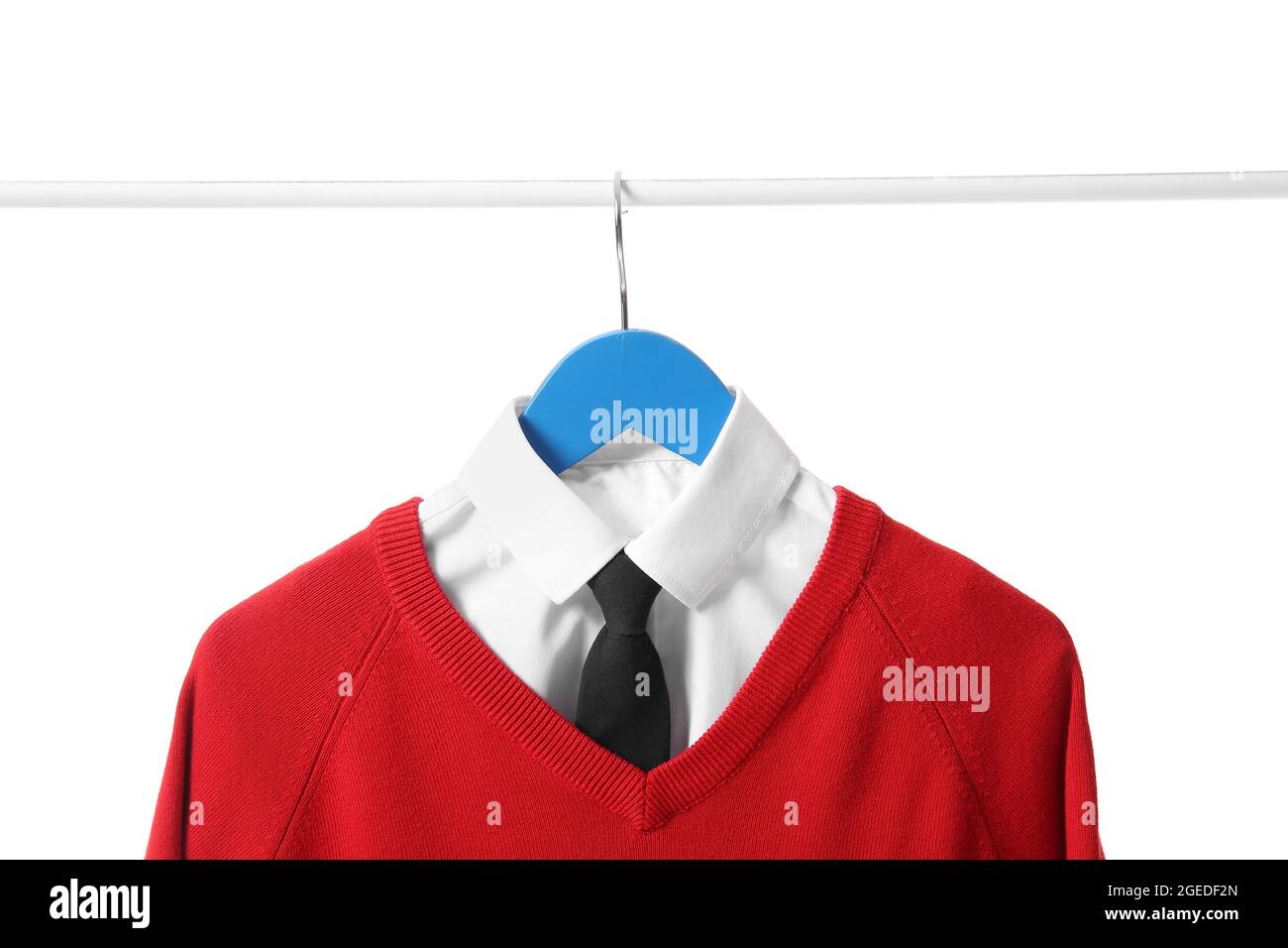 Hanger with stylish school uniform on white background Stock Photo - Alamy