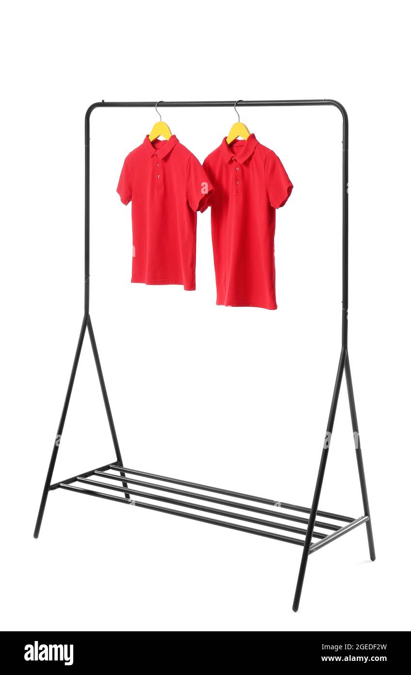 Rack with stylish t-shirts on white background Stock Photo - Alamy