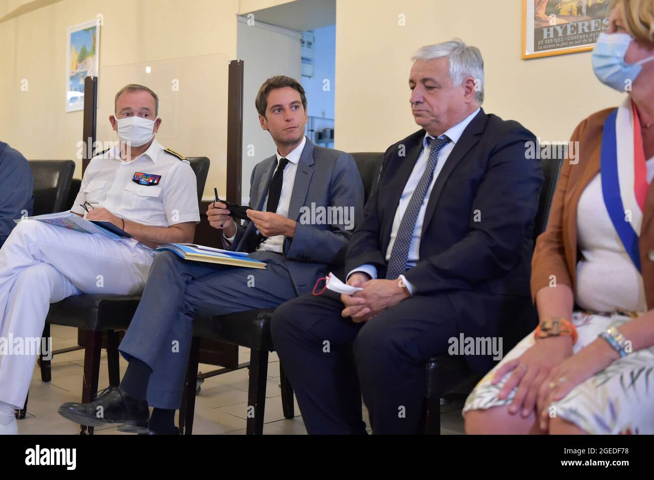 August 18, 2020, Brignoles, Var, France: (L to R) Evence Richard (prefet du var), Gabriel Attal (spokesman for the government), Didier Bremond (Mayor of Brignoles) and ValÃ©rie Gomez-Bassac (deputy LREM du Var) during a meeting with hotel and restaurant owners concerning the sanitary pass implementation..The sanitary pass for shops and restaurants is being implemented gradually since the beginning of August. The government's goal is to have at least 50 million people receive their first covid-19 vaccine injection by the end of August. Government officials are increasing their visits to health Stock Photo