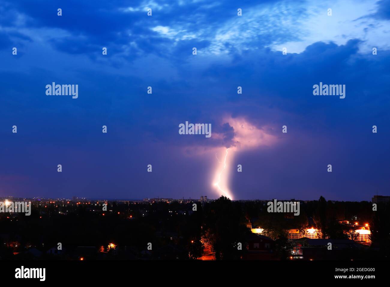 Dark sky with lightning over night city Stock Photo - Alamy
