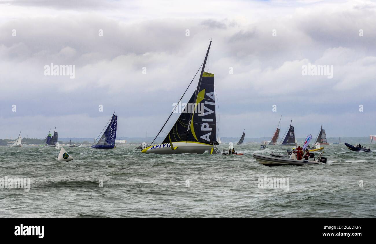 Apivia  at the start of the 2021 Rolex Fastnet Race and who was the 1st of the 13-strong Imoca 60 fleet to arrive in Cherbourg. Cowes,Isle of Wight,UK Stock Photo