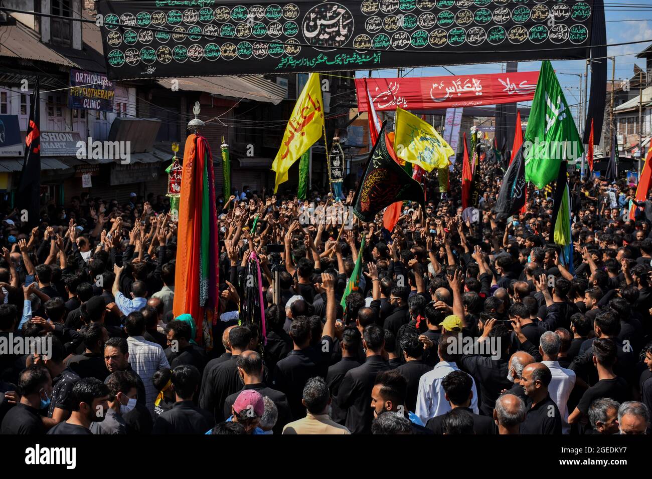Kashmiri Shiite Muslims take part in a ritual religious procession ...