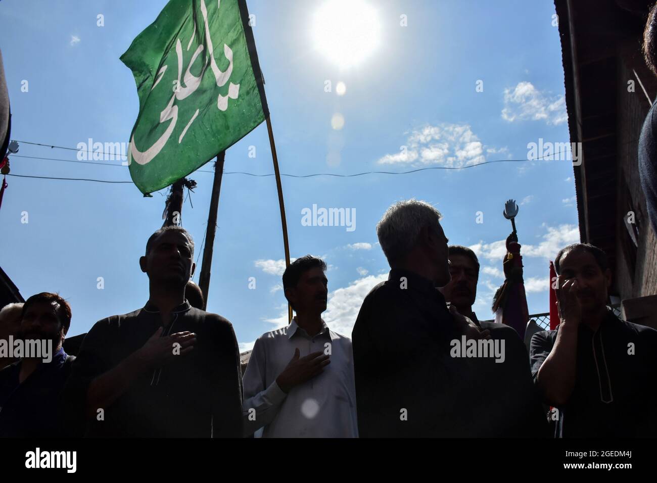 Kashmiri Shiite Muslims take part in a ritual religious procession ...