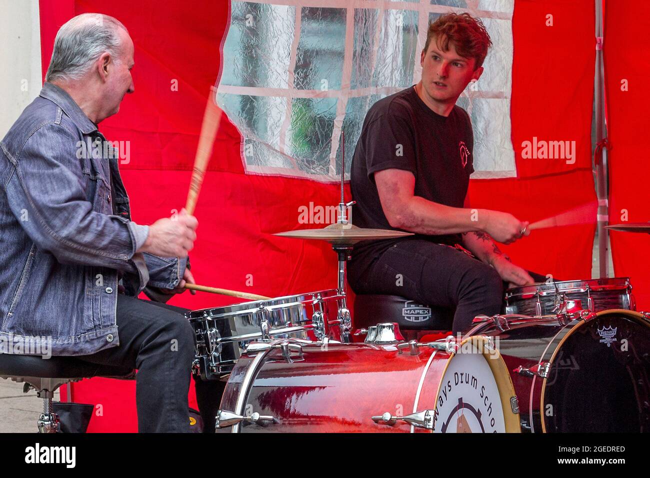 Two drummers play together during a street performance Stock Photo Alamy