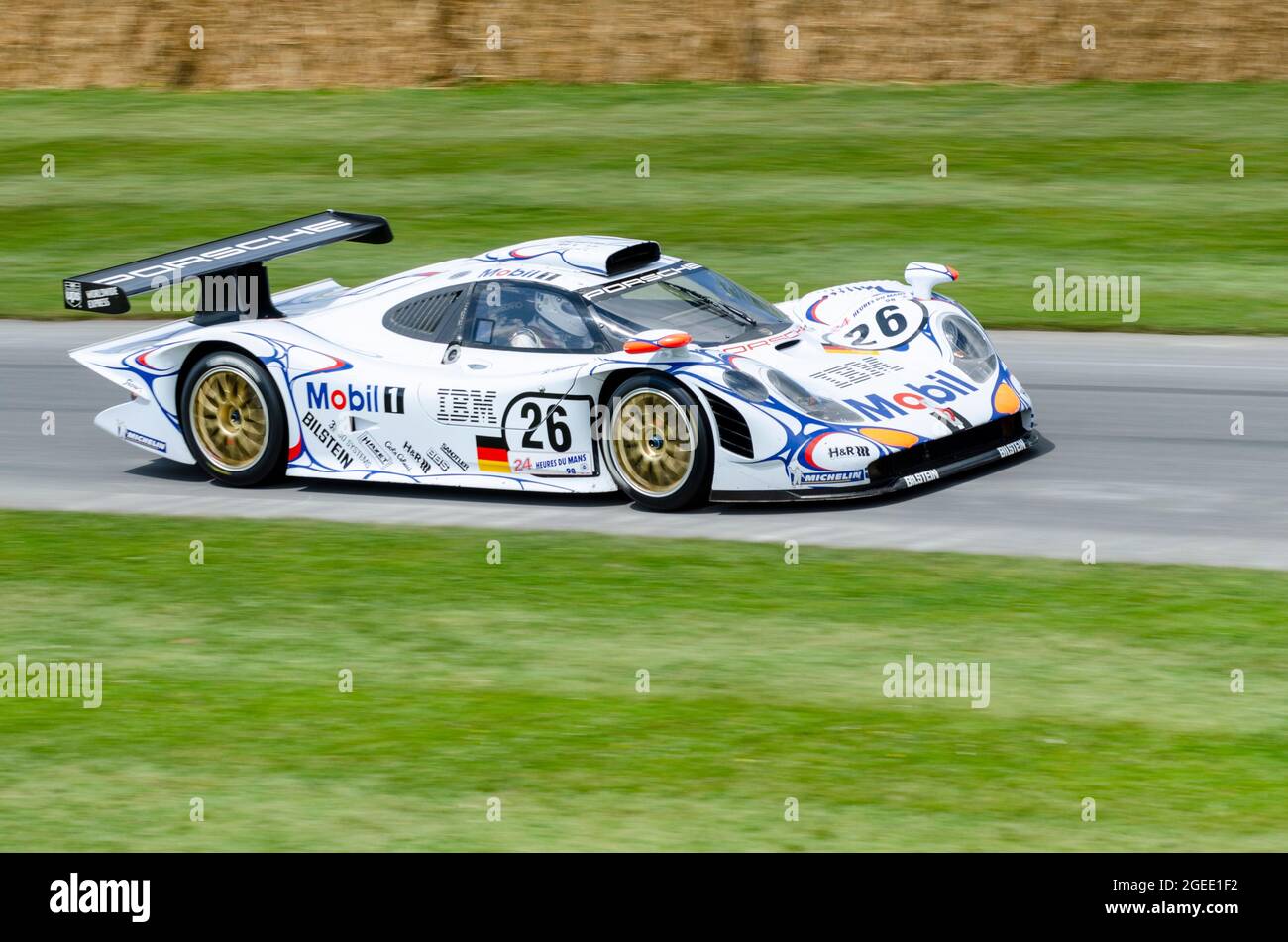 1998 Le Mans-winning Porsche 911 GT1 racing car driving up the hill climb  track at the Goodwood Festival of Speed motor racing event 2014 Stock Photo  - Alamy