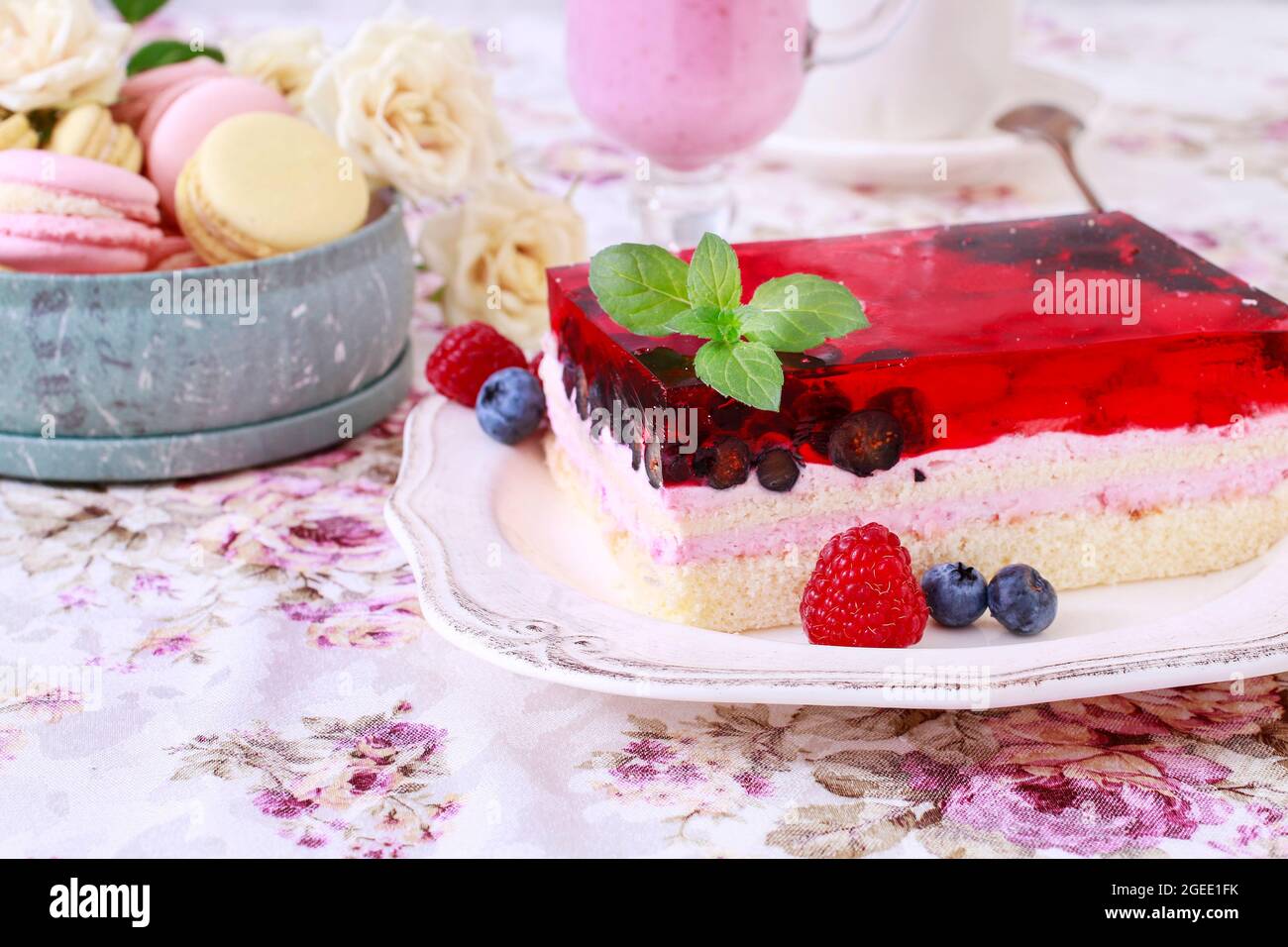 Layer fruit cake decorated with lemon balm leaf. Party time Stock Photo