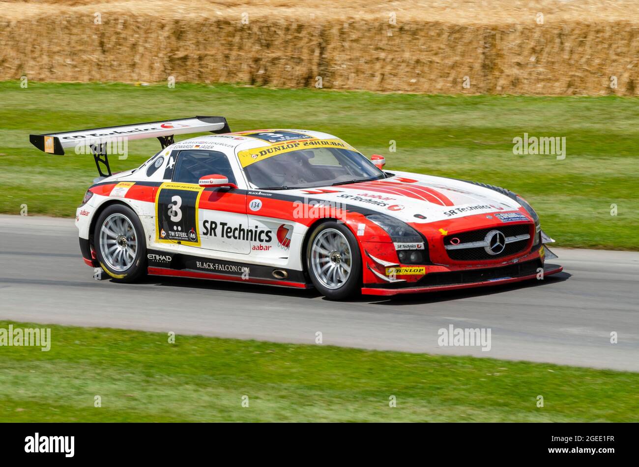 2012 Mercedes-Benz SLS AMG GT3 endurance racer racing car driving up the hill climb track at the Goodwood Festival of Speed motor racing event 2014. Stock Photo