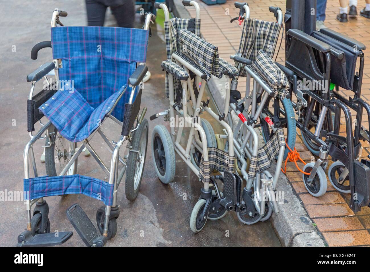 Many Foldable Wheelchairs at Street in Hong Kong Stock Photo Alamy