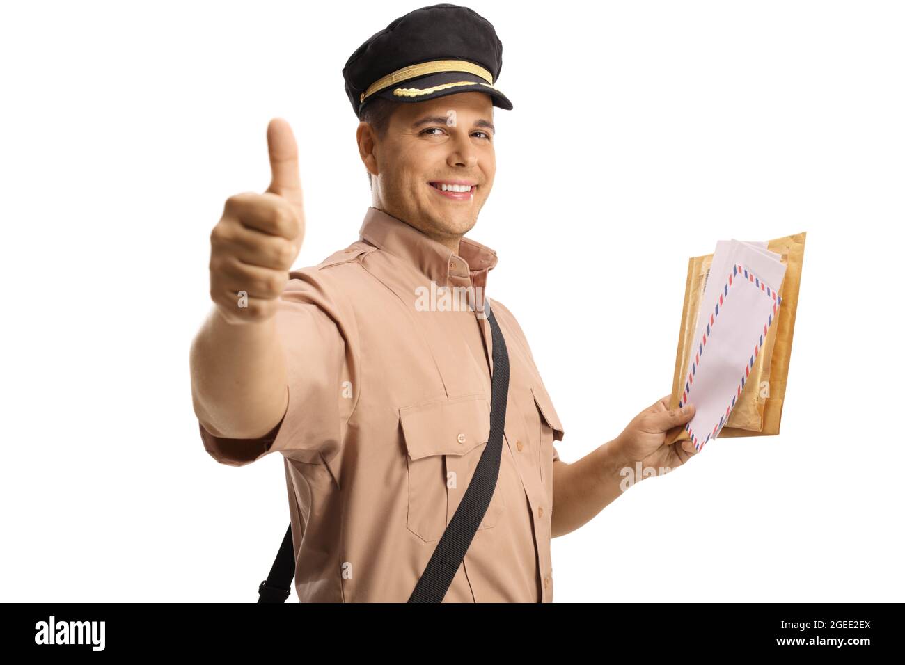 Smiling mailman holding a letter and gesturing a thumb up sign isolated ...