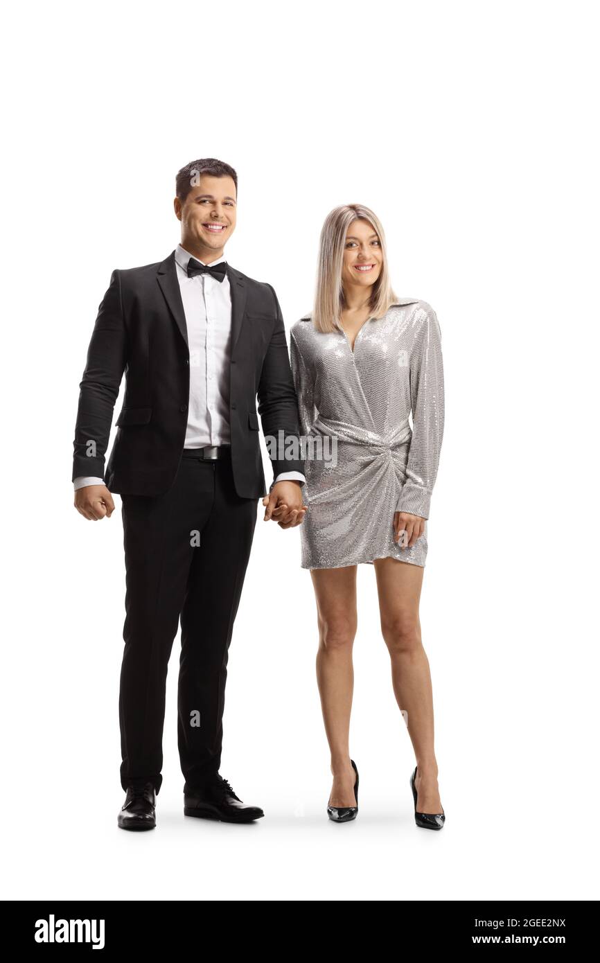 Full length portrait of an elegant young couple holding hands isolated ...