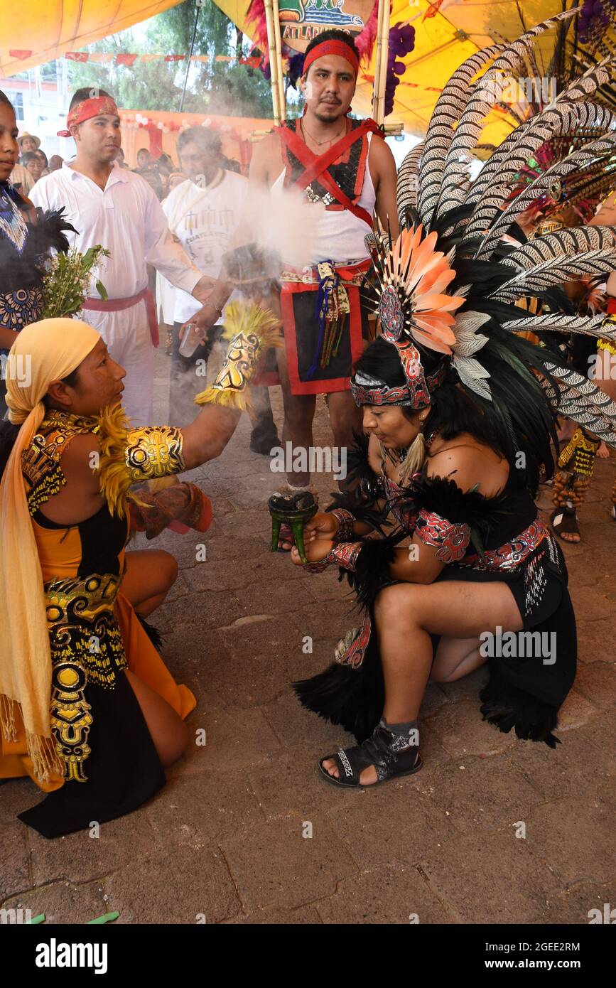 Before participating in a ceremonial dance, dancers undergo a ...