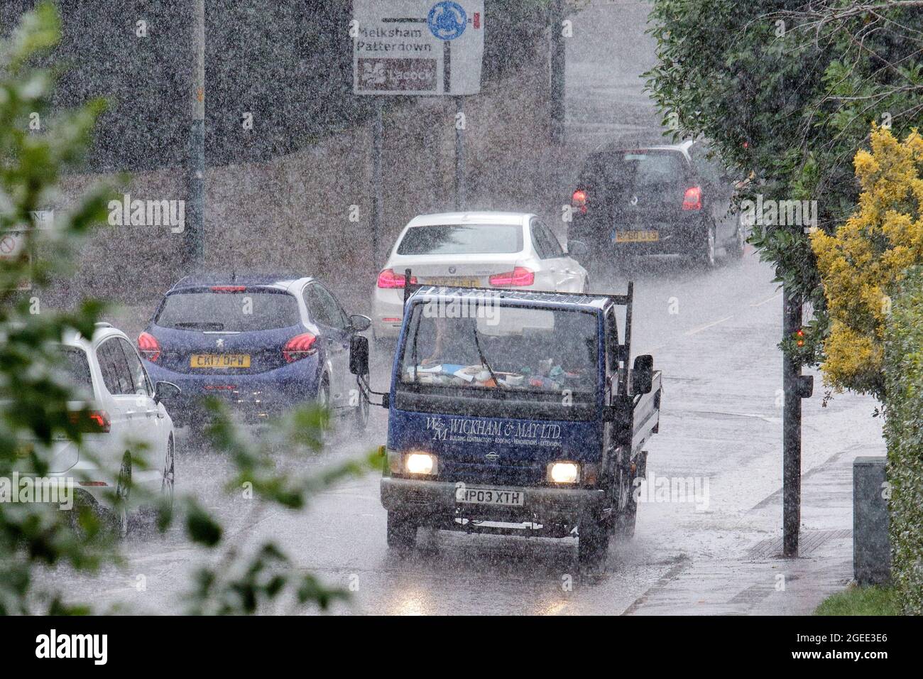Chippenham, Wiltshire, UK. 19th August, 2021. Drivers are pictured braving heavy rain in Chippenham as torrential rain showers make their way across the UK. Credit: Lynchpics/Alamy Live News Stock Photo