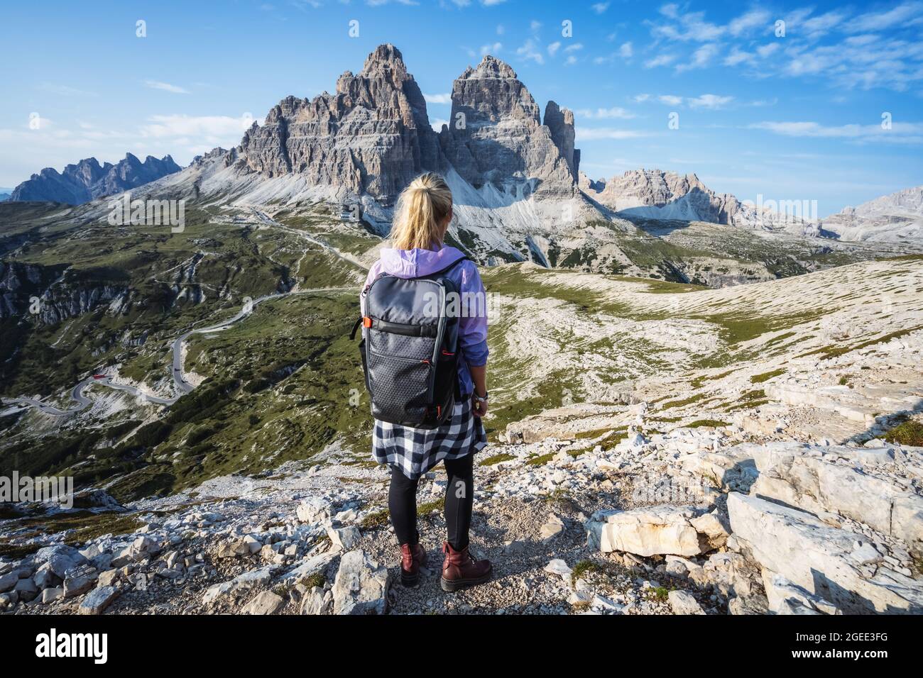 Woman hiker exploring Tre Cime di Lavaredo national park. Trentino-Alto-Adige, Dolomiti, Italy Stock Photo